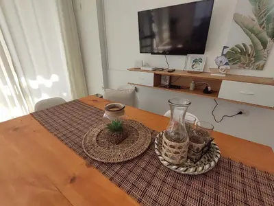 a table with two vases on top of it at Playa ChinchaHouse - Agradable casa de playa en Chinchaycamac in Chincha Baja