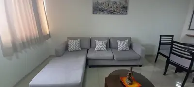 a living room with a couch and a table at Dpt suite pardo 610 in Lima