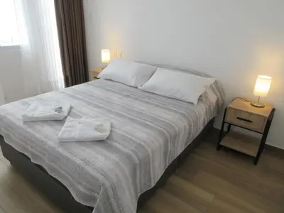 a bedroom with a bed with two towels on it at Venue Studios in Lima