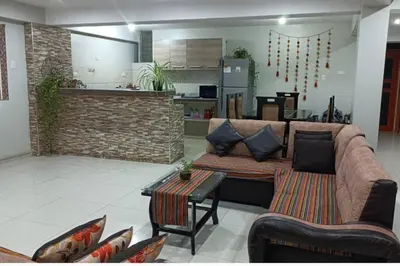 a living room with a couch and a table at Union Garden Apartments in Cusco