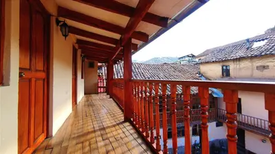 a balcony with a view of a building at Korilazos in Cusco