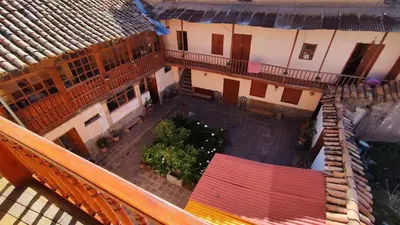 an overhead view of a courtyard in a building at Korilazos in Cusco