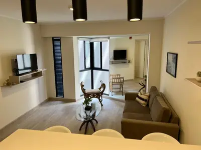 a living room with a couch and a table at BARRANCO Apartment Lima Peru in Lima