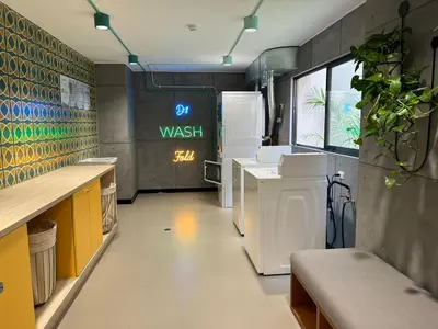 a kitchen with a washing machine and a refrigerator at BARRANCO Apartment Lima Peru in Lima