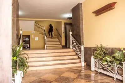 a person walking down the stairs in a building at Apartamento Entero en Centro de Miraflores - 2 habitaciones in Lima
