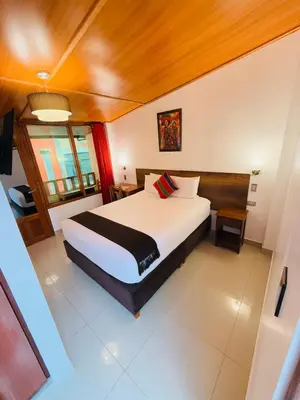 a bedroom with a large bed in a room at Inti Pacha Palace Machupicchu in Machu Picchu