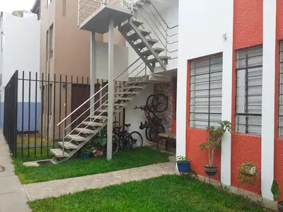 a spiral staircase on the side of a building at Acogedor departamento en el centro de Barranco in Lima