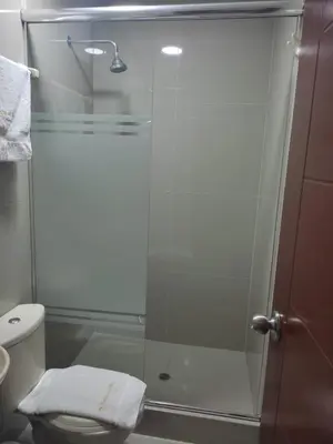 a glass shower in a bathroom with a toilet at Hotel Terrazas Del Mar in Huacho