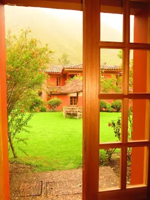 a window view of a yard from a house at Tierra Viva Ollantaytambo in Ollantaytambo