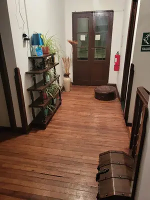 a hallway with a wooden floor and a door at Natural B&B Guest House in Cusco