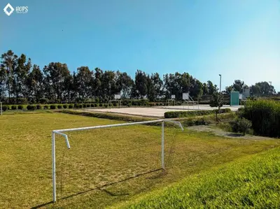 a soccer goal in the middle of a field at HOP OHANA exclusiva en campo y playa en Chincha in Chincha Baja