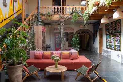 a living room with a couch and chairs and a table at Viajero Cusco Hostel in Cusco