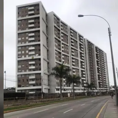 a large white building on the side of a street at departamento de 1 dormitorio in Lima