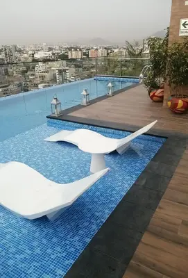 two white surfboards sitting on top of a swimming pool at Apartamento acogedor en Barranco - cerca a Miraflores in Lima