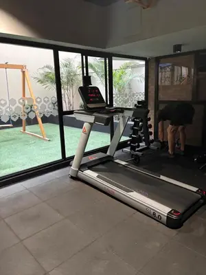 a room with a gym with a treadmill and a swing at Apartamento acogedor en Barranco - cerca a Miraflores in Lima