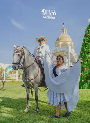 a woman standing next to a man on a horse at Macacona Hacienda Hotel in Ica