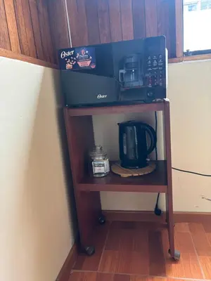 a coffee cart with a box on top of it at Apartamento zona histórica Barranco Desayuno incluido in Lima