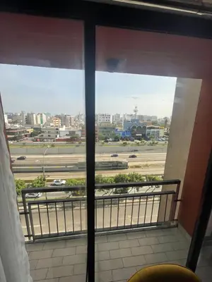 a view of a city from a window at Departamento completo en Miraflores Surquillo in Lima
