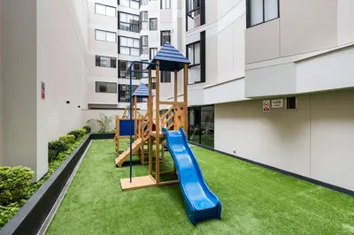 a playground in a building with a slide at Barranco inolvidable BR1 in Lima