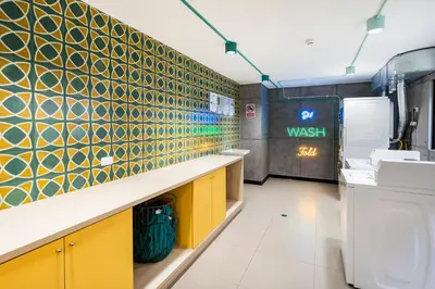 a washroom with yellow and green tiles on the wall at Barranco inolvidable BR1 in Lima