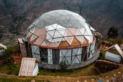 an observatory with a glass dome on top of a mountain at Stardome Spiritual Experience in Ollantaytambo