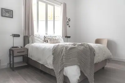 a bedroom with a large bed with a window at WasiPai Boutique Hotel in Lima