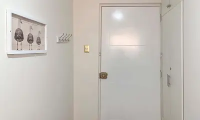 a white shower with a glass door in a room at Pershing lindo dpto amoblado 2dorm y wifi in Lima