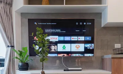 a tv screen in a living room with a plant at ALU Apartments - Miraflores in Lima