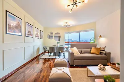 a living room with a couch and a table at ALU Apartments - Miraflores in Lima