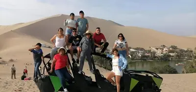 a group of people standing in front of a pyramid at Hotel Kallma Adventures in Ica
