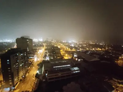 a view of a city at night with lights at Epiqe Manuel Olguin 600 in Lima