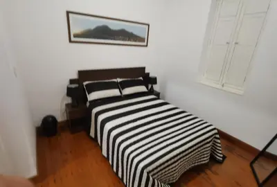 a black and white striped bed in a room at La Casona Hospedaje in Lima