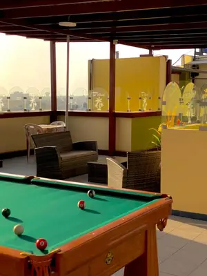 a pool table sitting on top of a building at Hotel Las Palmeras in Huacho