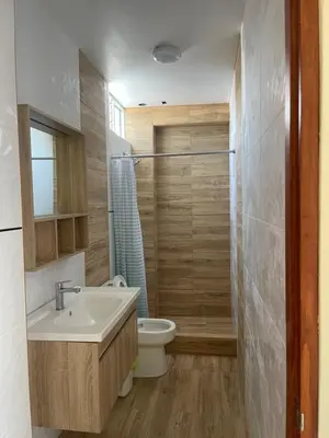 a bathroom with a sink and a toilet at Casa Galarza in Huancayo