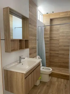 a bathroom with a sink and a toilet at Casa Galarza in Huancayo