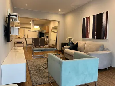 a living room with a couch and a table at MLA apartments - Larcomar in Lima