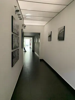 a hallway with art on the walls of a building at MLA apartments - Larcomar in Lima