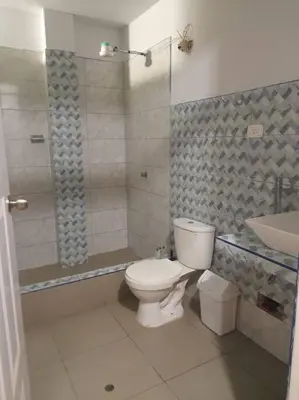a bathroom with a toilet and a shower and a sink at CASA PLAYA REFUGIO AZUL in Cerro Azul