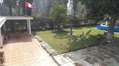 a garden with a flag on top of it at casa campestre marina in Chaclacayo