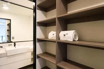 a bathroom with a sink and a mirror and towels at Navarrete by Wynwood House in Lima