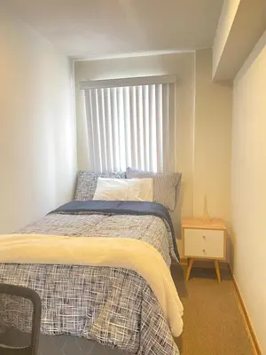 a small bedroom with a bed and a window at HABITACIÓN EN EDIFICIO CENTRO COLONIAL- Cerca al centro histórico in Lima