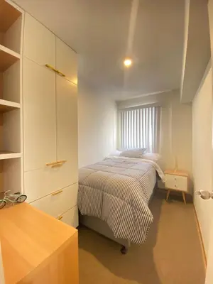 a small bedroom with a bed and a window at HABITACIÓN EN EDIFICIO CENTRO COLONIAL- Cerca al centro histórico in Lima