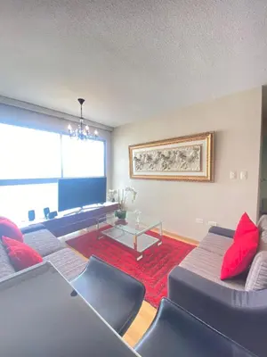 a living room with two couches and a table at HABITACIÓN EN EDIFICIO CENTRO COLONIAL- Cerca al centro histórico in Lima