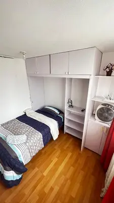 a small bedroom with a bed and a sink at IV Hermosa Habitacion Privada en Miraflores City in Lima