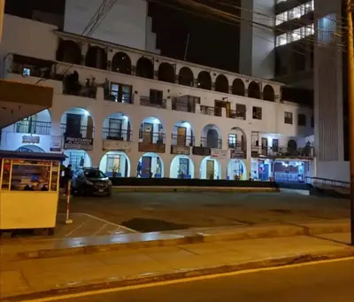 a building with a car parked in a parking lot at Centric, private, petfriendly apartments in Miraflores in Lima