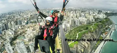 two people riding on a zip line over a city at III Acogedora Habitación Privada en Miraflores City in Lima