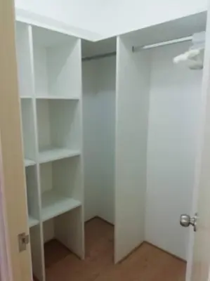 a white closet with white shelves and a white desk at Lindo y Espacioso Departamento muy cerca a Miraflores in Lima