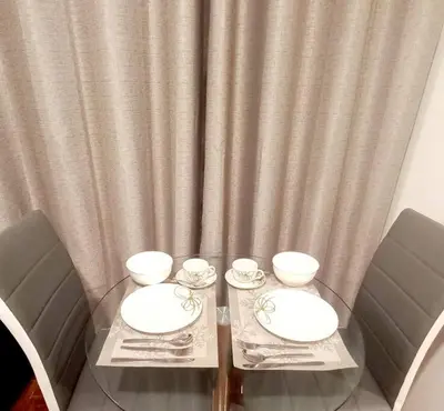a glass table with three bowls on top of it at Gorgeous Private Studio LIMA-Own Bathroom-Near Airport in Lima