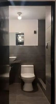 a bathroom with a toilet and a sink at Gorgeous Private Studio LIMA-Own Bathroom-Near Airport in Lima