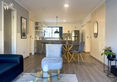 a living room with a couch and a table at Solar by Wynwood House in Lima